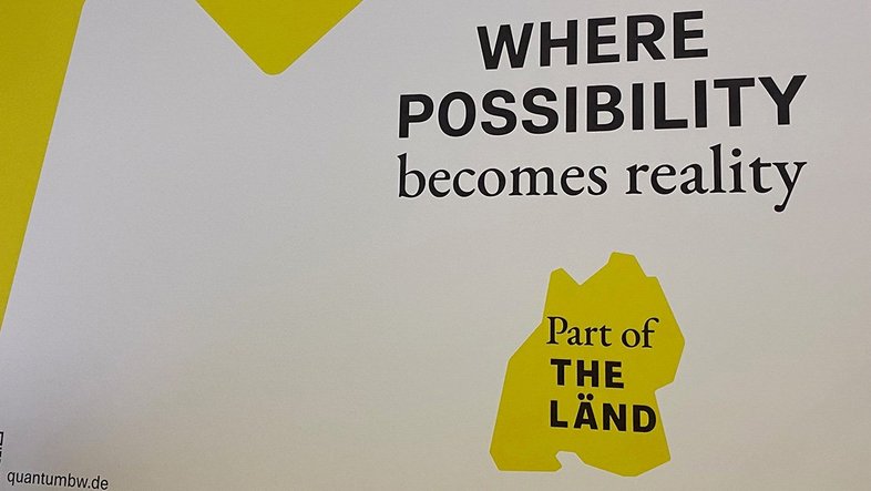 Plakat mit dem Schriftzug "WHERE POSSIBILITY becomes reality"